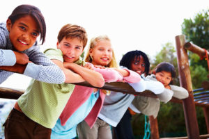 Children-leaning-on-rail_Small